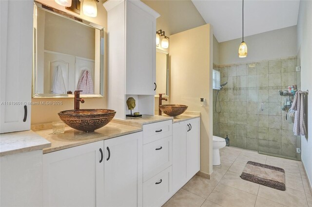 411 NW 201st Ave, Pembroke Pines, FL 33029 - bathroom with double vanity, a tile shower, and tile patterned flooring
