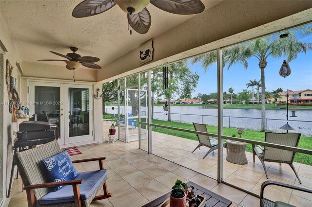 411 NW 201st Ave, Pembroke Pines, FL 33029 - unfurnished sunroom featuring ceiling fan, a water view, and french doors