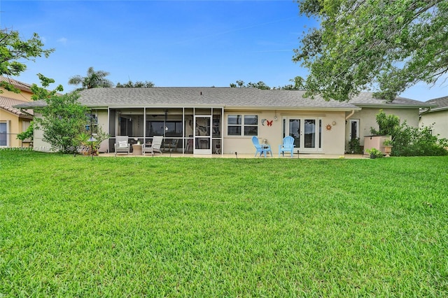 411 NW 201st Ave, Pembroke Pines, FL 33029 - back of house featuring a lawn, a sunroom, and stucco siding