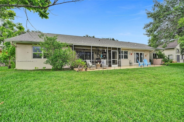 411 NW 201st Ave, Pembroke Pines, FL 33029 - back of house with stucco siding, a lawn, a patio area, a sunroom, and roof with shingles
