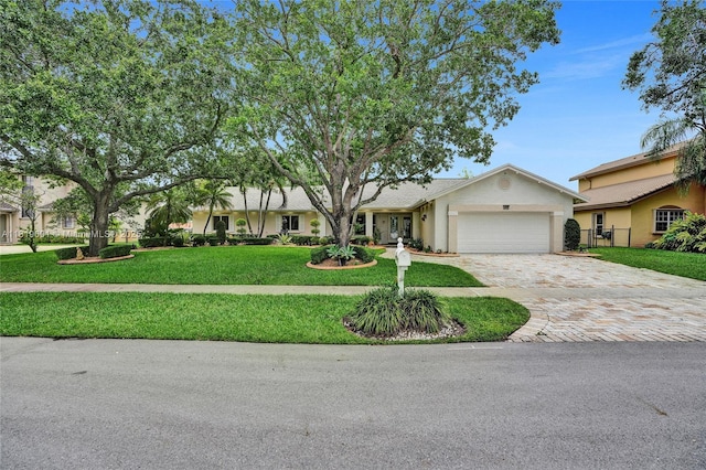 411 NW 201st Ave, Pembroke Pines, FL 33029 - ranch-style home featuring an attached garage, decorative driveway, a front yard, and stucco siding