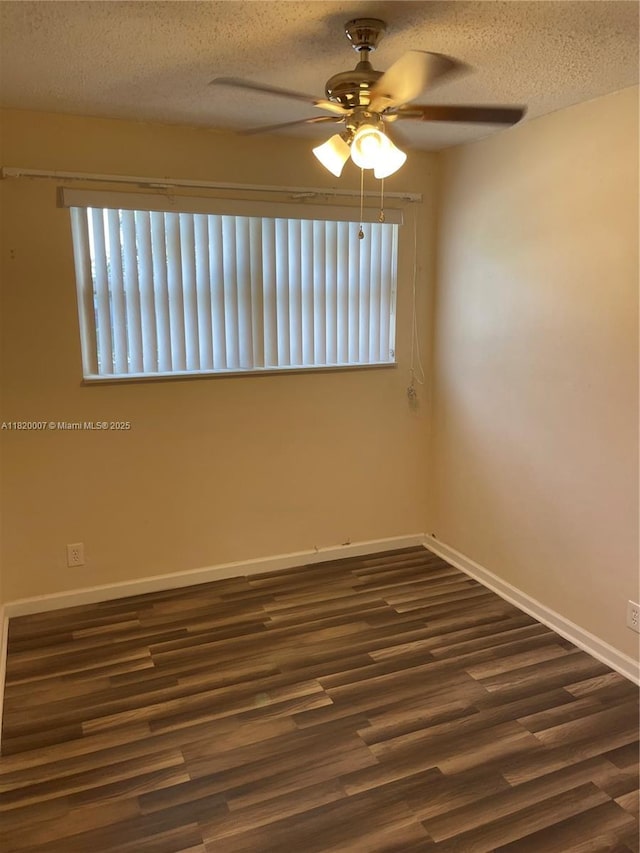 357 SW 1st Ter, Deerfield Beach, FL 33441 - empty room with a ceiling fan, dark wood-type flooring, baseboards, and a textured ceiling