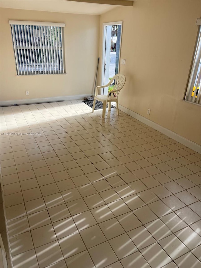 357 SW 1st Ter, Deerfield Beach, FL 33441 - unfurnished room featuring baseboards and tile patterned flooring