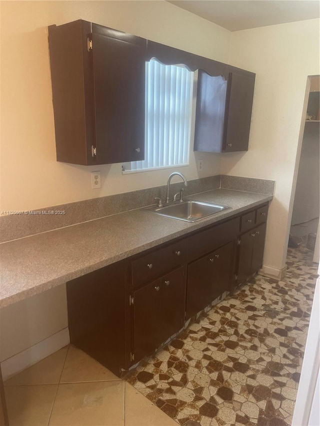 357 SW 1st Ter, Deerfield Beach, FL 33441 - kitchen featuring a sink and dark brown cabinetry