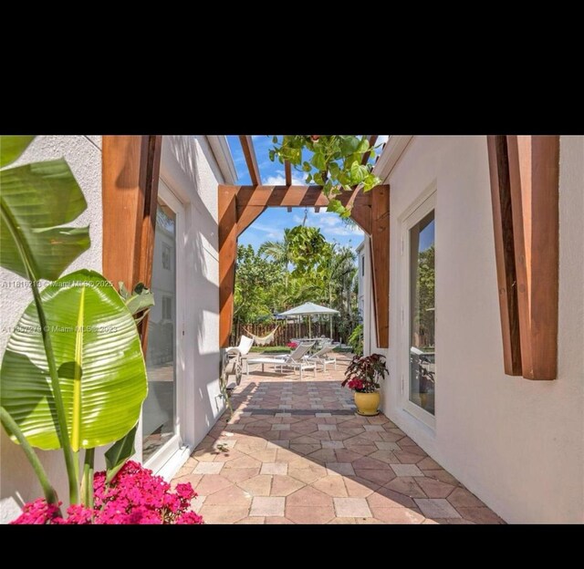 659 NE 73rd St, Miami, FL 33138 - view of patio featuring a pergola