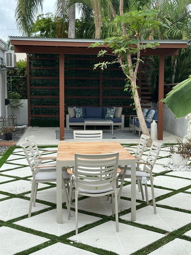 659 NE 73rd St, Miami, FL 33138 - view of patio / terrace featuring an outdoor living space and outdoor dining space