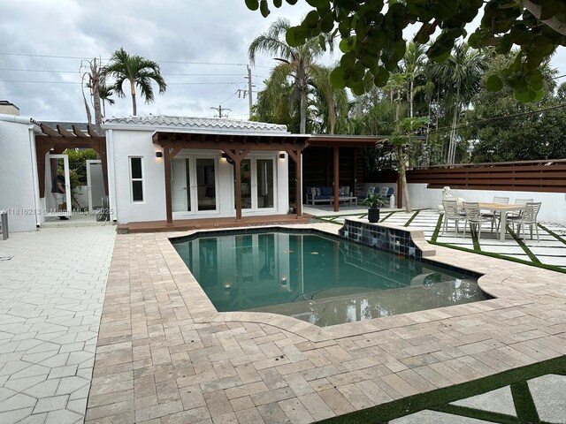 659 NE 73rd St, Miami, FL 33138 - outdoor pool with french doors, a patio area, and a pergola