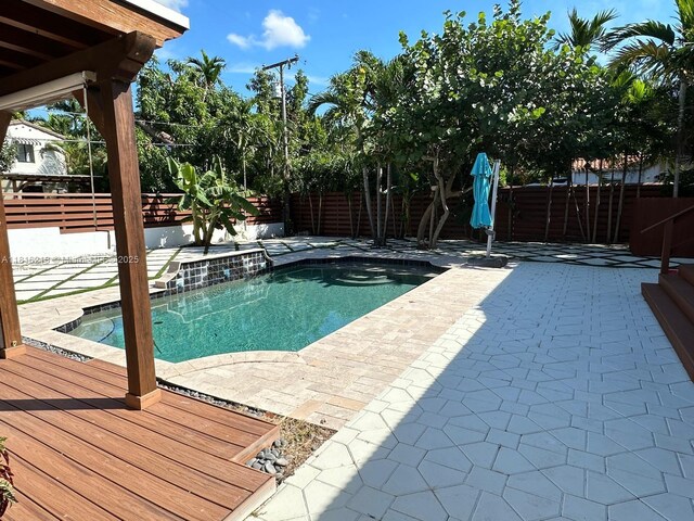 659 NE 73rd St, Miami, FL 33138 - view of swimming pool with a fenced backyard and a patio area