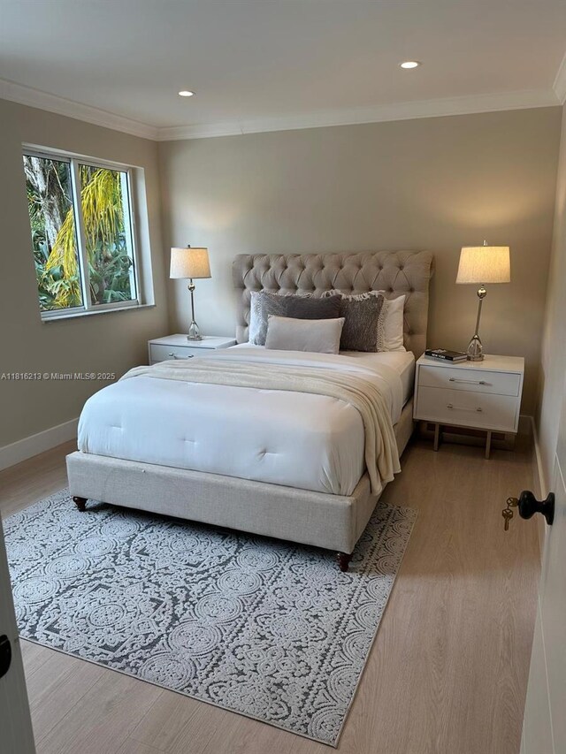 659 NE 73rd St, Miami, FL 33138 - bedroom featuring wood finished floors, crown molding, and recessed lighting