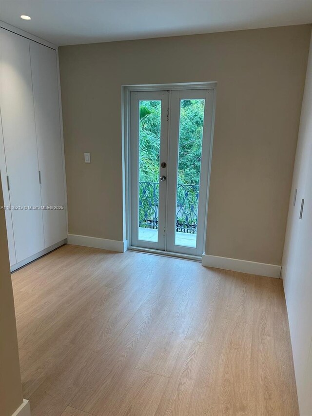 659 NE 73rd St, Miami, FL 33138 - spare room with light wood-style flooring and french doors