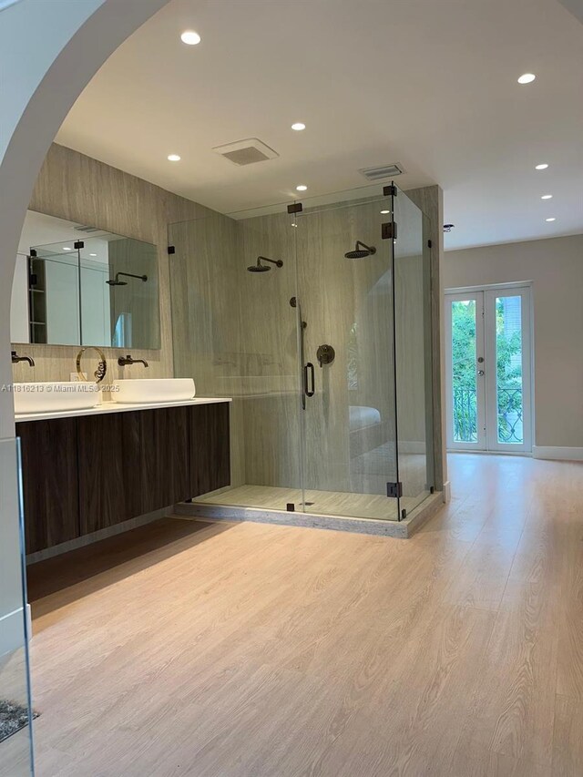 659 NE 73rd St, Miami, FL 33138 - full bathroom with wood finished floors, vanity, recessed lighting, and a stall shower