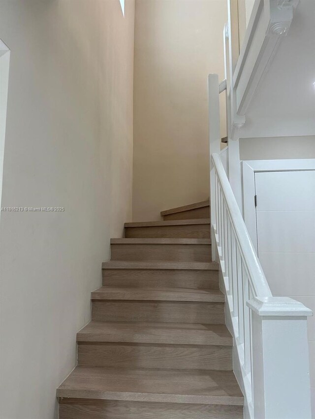 659 NE 73rd St, Miami, FL 33138 - stairs featuring wood finished floors
