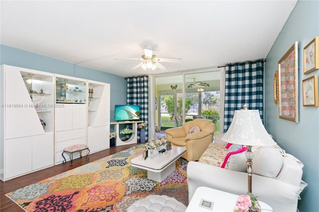1001 NE 14th Ave Unit 107, Hallandale Beach, FL 33009 - living area featuring wood finished floors and ceiling fan