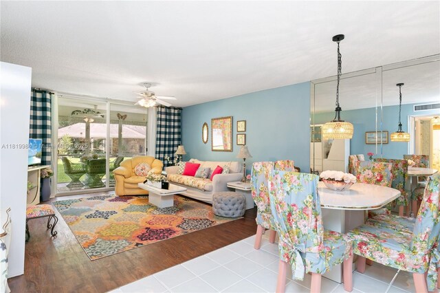 1001 NE 14th Ave Unit 107, Hallandale Beach, FL 33009 - living room featuring ceiling fan and tile patterned floors