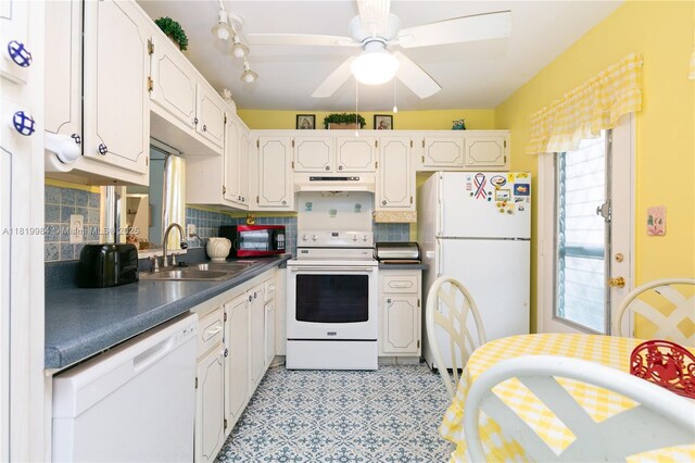 1001 NE 14th Ave Unit 107, Hallandale Beach, FL 33009 - kitchen with white appliances, a sink, decorative backsplash, under cabinet range hood, and a ceiling fan