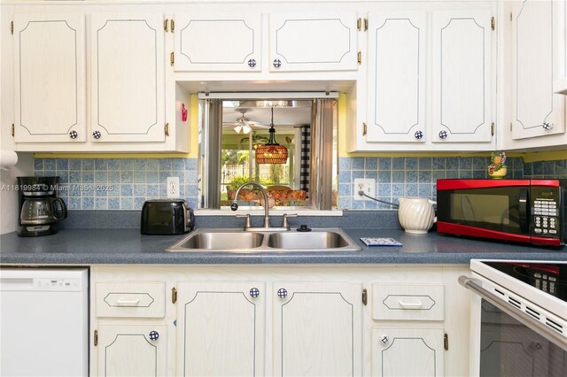 1001 NE 14th Ave Unit 107, Hallandale Beach, FL 33009 - kitchen with dishwasher, a sink, white cabinets, and dark countertops