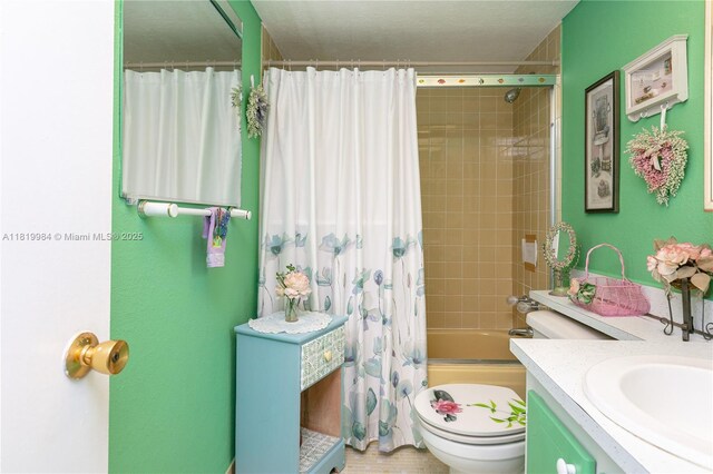 1001 NE 14th Ave Unit 107, Hallandale Beach, FL 33009 - bathroom with toilet, vanity, and shower / bath combo with shower curtain