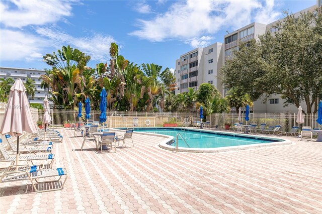1001 NE 14th Ave Unit 107, Hallandale Beach, FL 33009 - community pool with a patio