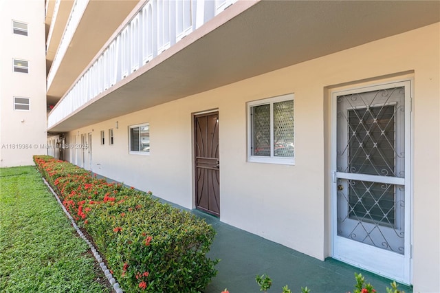 1001 NE 14th Ave Unit 107, Hallandale Beach, FL 33009 - entrance to property featuring stucco siding and board and batten siding