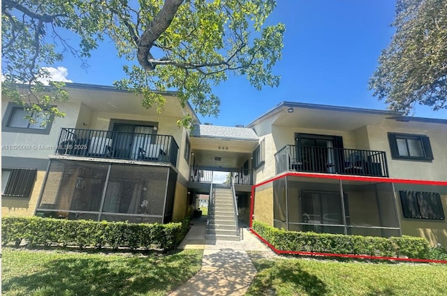 523 Trace Cir Unit 105, Deerfield Beach, FL 33441 - view of building exterior featuring stairway