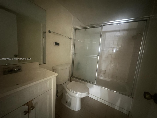 523 Trace Cir Unit 105, Deerfield Beach, FL 33441 - bathroom featuring vanity, enclosed tub / shower combo, toilet, and tile patterned floors