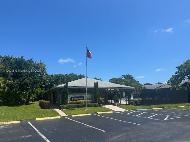 523 Trace Cir Unit 105, Deerfield Beach, FL 33441 - view of property featuring uncovered parking