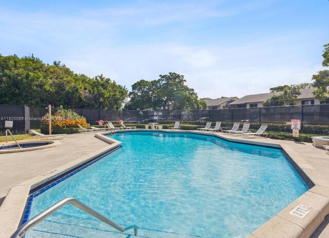 523 Trace Cir Unit 105, Deerfield Beach, FL 33441 - community pool featuring a patio area