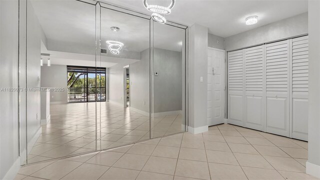 5550 NW 44th St Unit 205B, Lauderhill, FL 33319 - bathroom featuring tile patterned floors, baseboards, and a closet