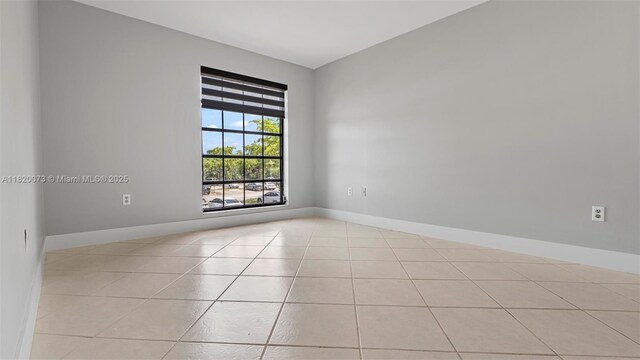 5550 NW 44th St Unit 205B, Lauderhill, FL 33319 - unfurnished room with light tile patterned floors and baseboards