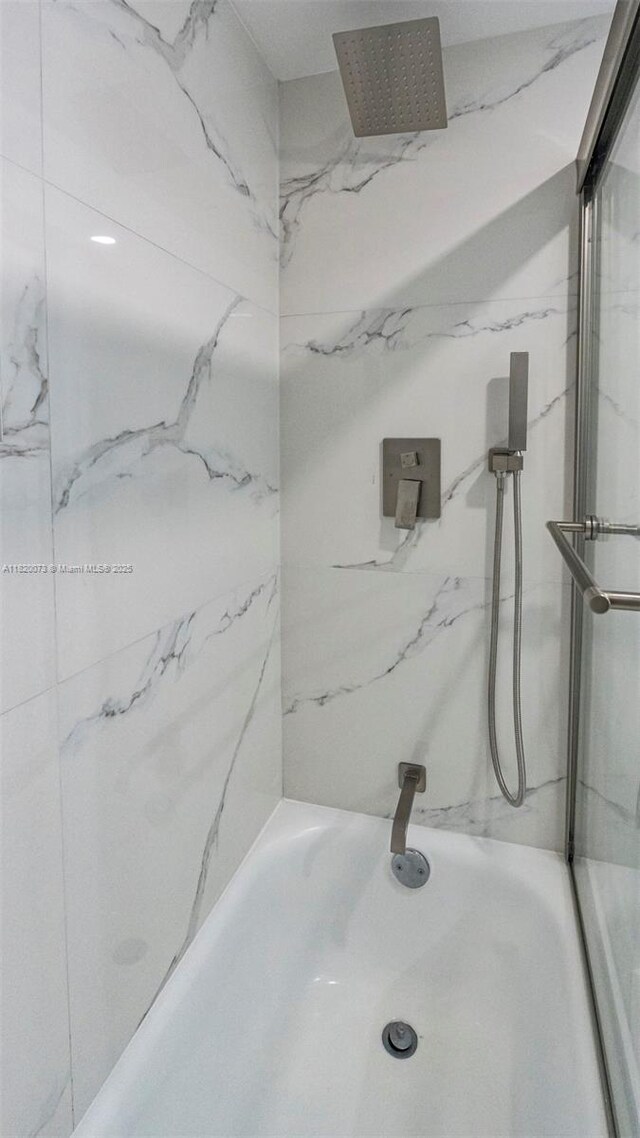 5550 NW 44th St Unit 205B, Lauderhill, FL 33319 - bathroom featuring a marble finish shower