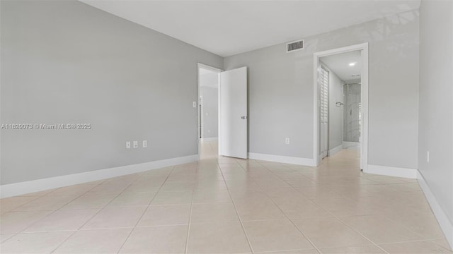 5550 NW 44th St Unit 205B, Lauderhill, FL 33319 - empty room featuring light tile patterned floors and baseboards