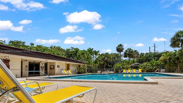 5550 NW 44th St Unit 205B, Lauderhill, FL 33319 - community pool featuring a patio area