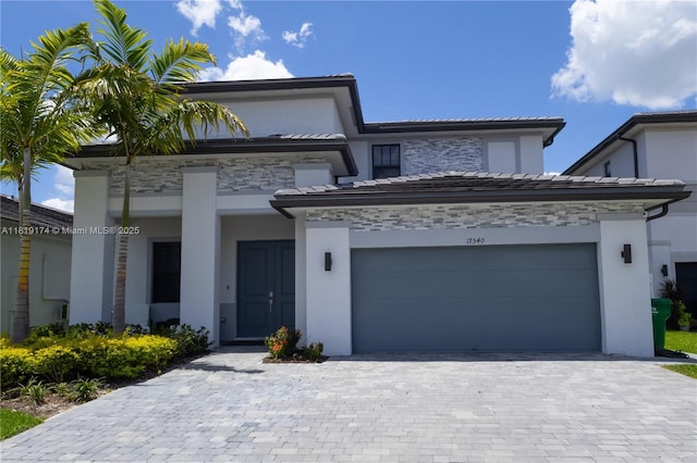 17540 SW 46th St, Miramar, FL 33029 - view of front facade featuring stucco siding, a garage, decorative driveway, and stone siding