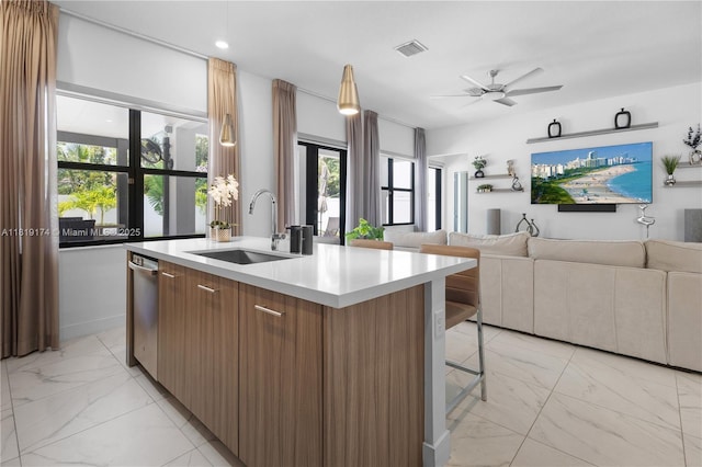 17540 SW 46th St, Miramar, FL 33029 - kitchen featuring a sink, light marble finish floors, modern cabinets, open floor plan, and a center island with sink