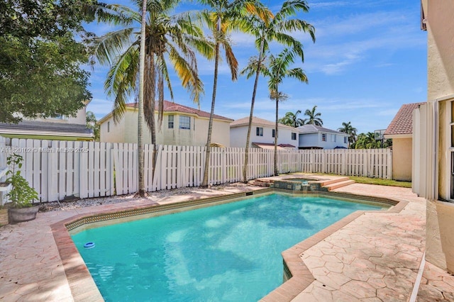 164 Granada Ave, Weston, FL 33326 - view of swimming pool featuring a fenced backyard, a patio area, a pool with connected hot tub, and a residential view