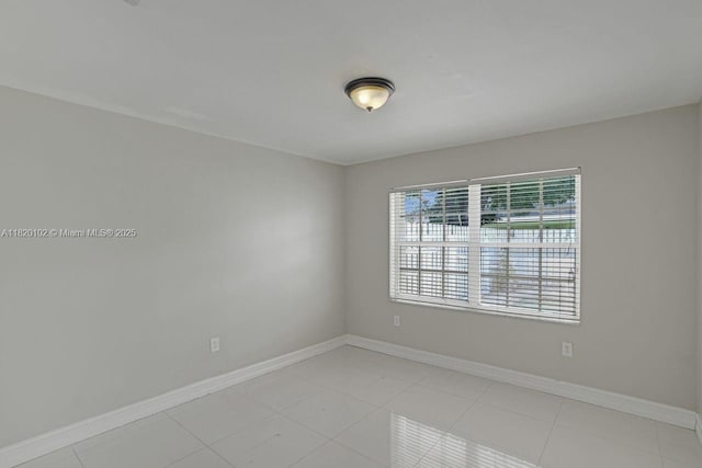 164 Granada Ave, Weston, FL 33326 - unfurnished room with baseboards and light tile patterned floors