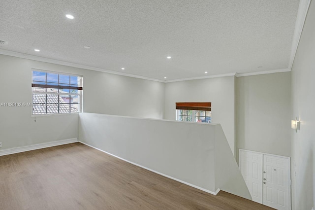 164 Granada Ave, Weston, FL 33326 - unfurnished room with wood finished floors, a textured ceiling, plenty of natural light, recessed lighting, and ornamental molding