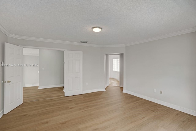 164 Granada Ave, Weston, FL 33326 - unfurnished bedroom with a textured ceiling, light wood finished floors, and ornamental molding