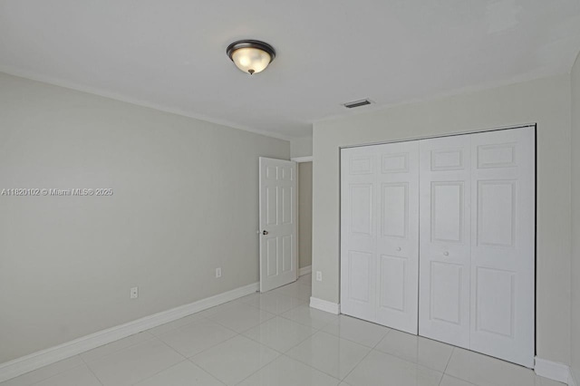 164 Granada Ave, Weston, FL 33326 - unfurnished bedroom with a closet and light tile patterned floors