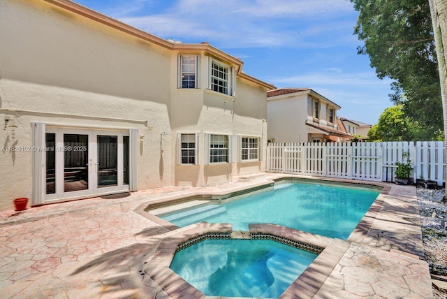 164 Granada Ave, Weston, FL 33326 - view of swimming pool with a patio, a pool with connected hot tub, and french doors