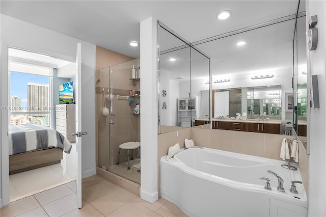 1945 S Ocean Dr Unit 2209, Hallandale Beach, FL 33009 - ensuite bathroom featuring a stall shower, a bath, vanity, tile patterned flooring, and recessed lighting
