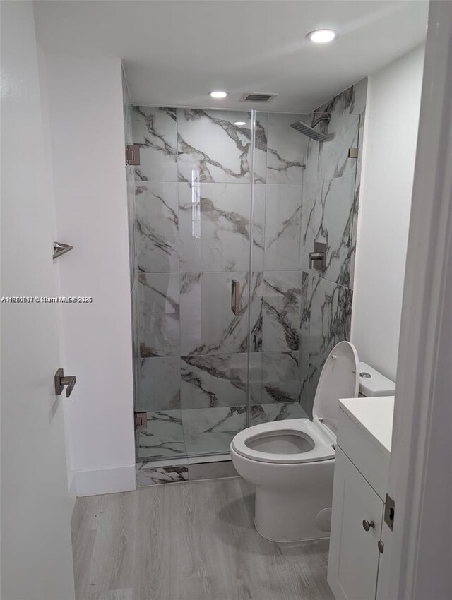 2801 NE 183rd St Unit 1709W, Aventura, FL 33160 - bathroom with a marble finish shower, vanity, recessed lighting, and toilet