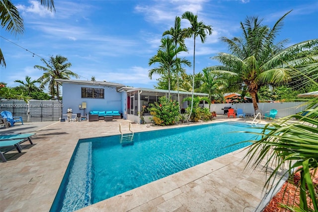 14925 NE 7th Ave, Miami, FL 33161 - view of pool with a patio, an outdoor hangout area, and a sunroom