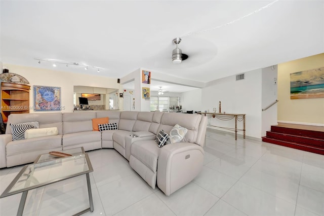 14925 NE 7th Ave, Miami, FL 33161 - living room featuring ceiling fan, light tile patterned floors, stairs, and rail lighting