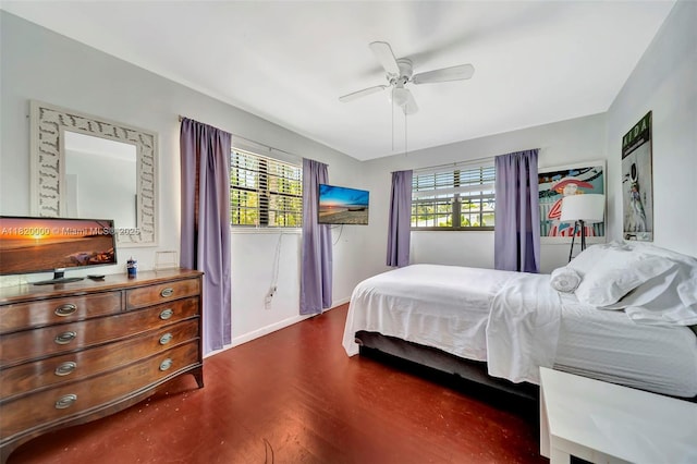 14925 NE 7th Ave, Miami, FL 33161 - bedroom with dark wood finished floors, ceiling fan, and baseboards