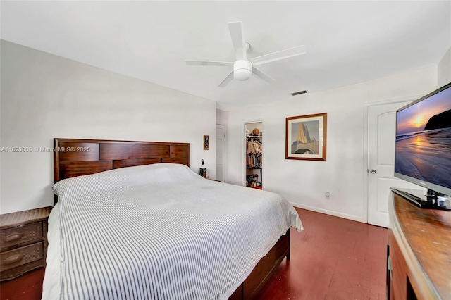 14925 NE 7th Ave, Miami, FL 33161 - bedroom with a walk in closet, wood finished floors, a closet, ceiling fan, and baseboards