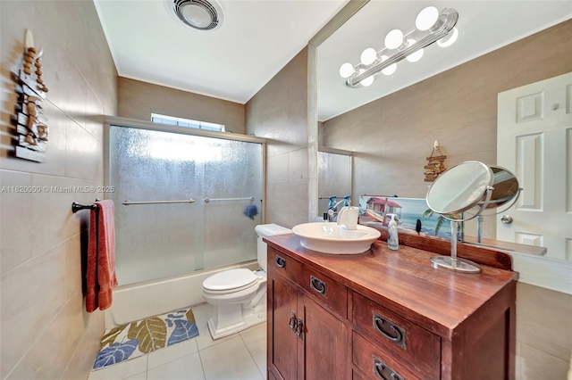 14925 NE 7th Ave, Miami, FL 33161 - bathroom featuring tile walls, tile patterned floors, enclosed tub / shower combo, toilet, and vanity