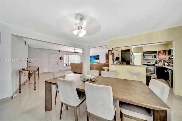 14925 NE 7th Ave, Miami, FL 33161 - dining area with a ceiling fan and light tile patterned floors
