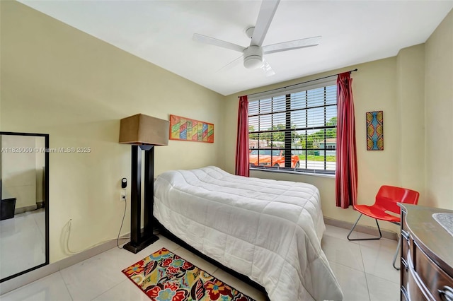 14925 NE 7th Ave, Miami, FL 33161 - bedroom featuring baseboards, light tile patterned floors, and a ceiling fan
