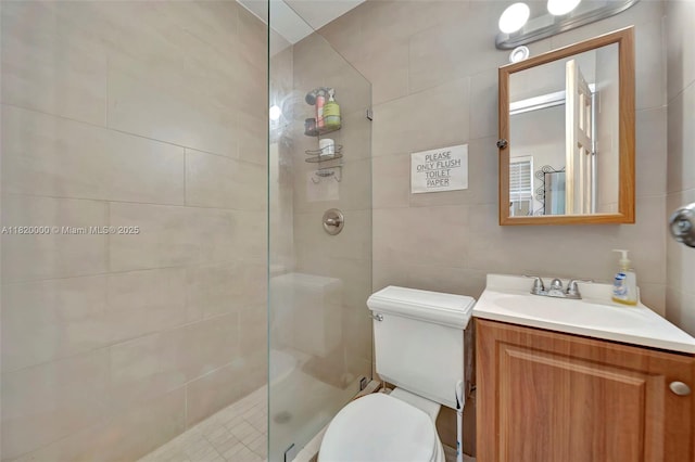 14925 NE 7th Ave, Miami, FL 33161 - bathroom with vanity, toilet, a tile shower, and tile walls